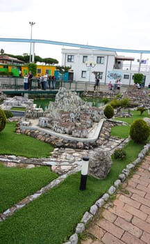 Viserba, Italy - June 25, 2024: People going at Theme park Italy in Miniature or Italia in Miniatura in Rimini, Italy - Reproduction of famous attractions in a small scale