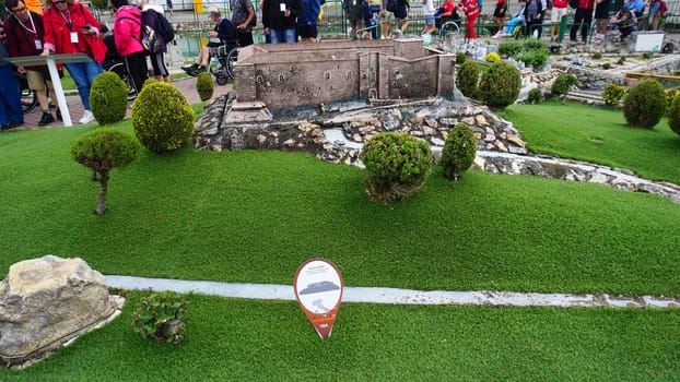 Viserba, Italy - June 25, 2024: People going at Theme park Italy in Miniature or Italia in Miniatura in Rimini, Italy - Reproduction of famous attractions in a small scale
