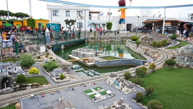 Viserba, Italy - June 25, 2024: People going at Theme park Italy in Miniature or Italia in Miniatura in Rimini, Italy - Reproduction of famous attractions in a small scale