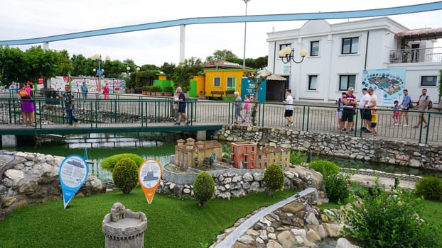 Viserba, Italy - June 25, 2024: People going at Theme park Italy in Miniature or Italia in Miniatura in Rimini, Italy - Reproduction of famous attractions in a small scale