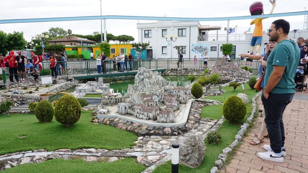 Viserba, Italy - June 25, 2024: People going at Theme park Italy in Miniature or Italia in Miniatura in Rimini, Italy - Reproduction of famous attractions in a small scale