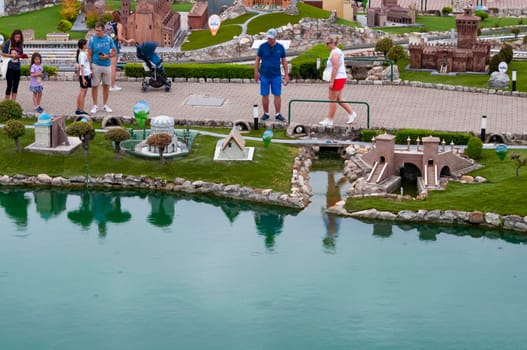 Viserba, Italy - June 25, 2024: People going at Theme park Italy in Miniature or Italia in Miniatura in Rimini, Italy - Reproduction of famous attractions in a small scale