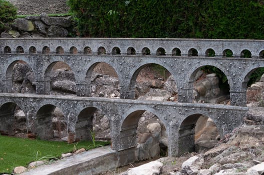 Viserba, Italy - June 25, 2024: Old bridge at Theme park Italy in Miniature or Italia in Miniatura in Rimini, Italy - Reproduction of famous attractions in a small scale