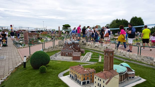 Viserba, Italy - June 25, 2024: People going at Theme park Italy in Miniature or Italia in Miniatura in Rimini, Italy - Reproduction of famous attractions in a small scale