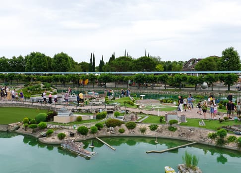 Viserba, Italy - June 25, 2024: People going at Theme park Italy in Miniature or Italia in Miniatura in Rimini, Italy - Reproduction of famous attractions in a small scale