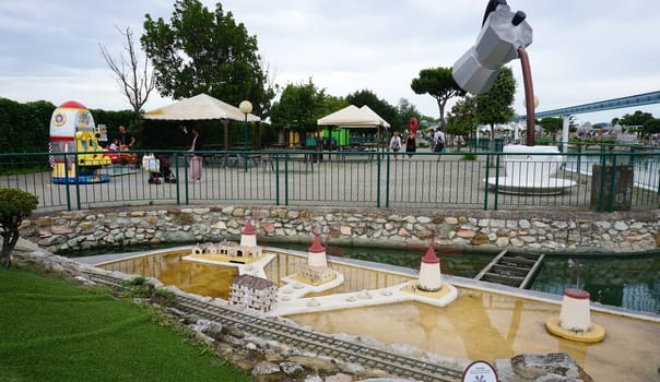 Viserba, Italy - June 25, 2024: People going at Theme park Italy in Miniature or Italia in Miniatura in Rimini, Italy - Reproduction of famous attractions in a small scale