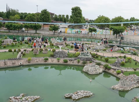Viserba, Italy - June 25, 2024: People going at Theme park Italy in Miniature or Italia in Miniatura in Rimini, Italy - Reproduction of famous attractions in a small scale