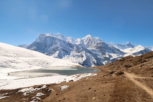 The Saano Khicho Lake in front Annapurna III, Gangapurna, Tarke Kang and Khangsar Kang, next to the Ice Lake, Kicho Tal, Khicho Ice Lake, close to Manang, Annapurna Circuit Trek, Nepal 2022