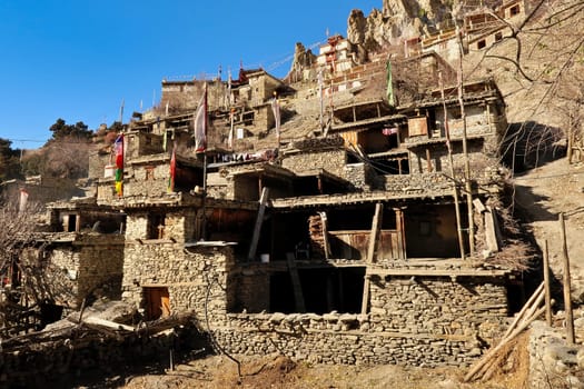 Traditional stone houses in front of a monastery in the rural village of Braka, Bhraka, Bhrakaa, Braga, Bhraga, close to Manang, Annapurna Circuit Trek, Nepal 2022