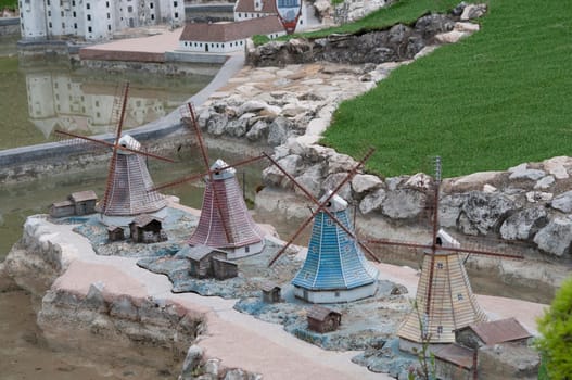 Viserba, Italy - June 25, 2024: Old Windmills in the Netherlands at Theme park Italy in Miniature or Italia in Miniatura in Rimini, Italy - Reproduction of famous attractions in a small scale