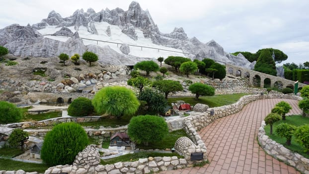 Viserba, Italy - June 25, 2024: Alps at Theme park Italy in Miniature or Italia in Miniatura in Rimini, Italy - Reproduction of famous attractions in a small scale