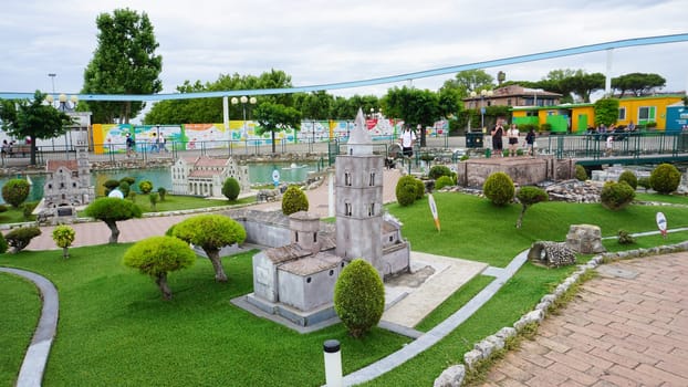 Viserba, Italy - June 25, 2024: People going at Theme park Italy in Miniature or Italia in Miniatura in Rimini, Italy - Reproduction of famous attractions in a small scale