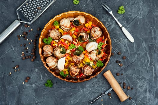 Edible stuffed snails with butter and herbs. Sardinian cuisine, Italian food.