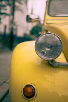 Antwerp, Belgium, July 21st 2024: Closeup view of headlight of classic car Citroen 2CV