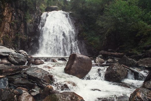 Korbu Waterfall at Lake Teletskoye in the Altai Mountains. The most famous lake waterfall