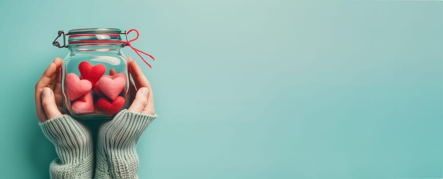 Hands holding a jar with red hearts, love and emotion concept, thank you, help and charity, christmas gift, valentine