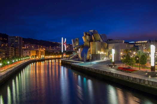 The seaport of Bilbao in the province of Biscay in northern Spain. View of the Nervion River, the Puente de la Salve (Bridge) and the Guggenheim Museum.