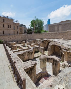 A view of the ruins of the bathhouse within the Shirvanshahs Palace in Baku, Azerbaijan. The stone structure shows the remnants of a once grand and functional building