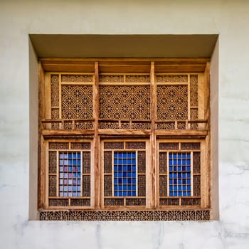 Intricate wooden window at the Shakikhanovs Palace in Shaki, Azerbaijan