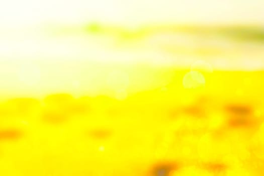 Abstract desert landscape background with yellow sand dust and sunny sky and bokeh circles. Beautiful texture.