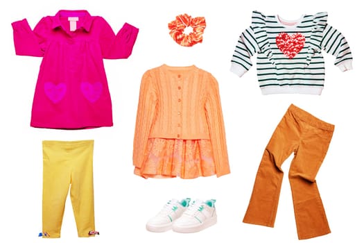Collage set of little girl summer clothes isolated on white. Kids apparel collection. Childs fashion clothing outfit. Skirt, shorts, shirt, dresses, pants, bag, sweater, sneaker.