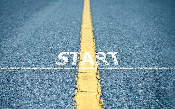Starting line on asphalt road, Business startup idea, Copy space background, Path to success, Business competition concept, Setting business goals.