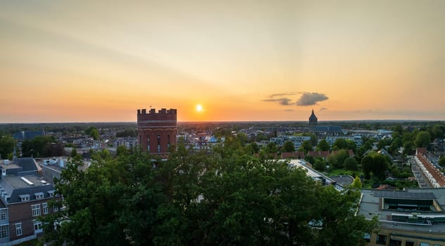 aerial view of a water tower and the medieval plechelmus basilica in Oldenzaal, Netherlands