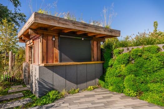 Garden shed with green roofing and vertical garden, green roofing concept