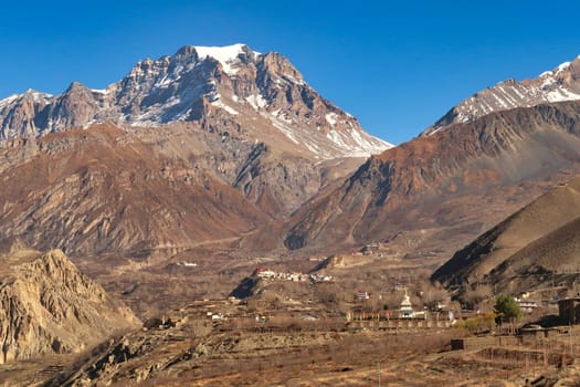 View onto Jangchup Choeten Temple, Pagoda, the village of Jharkot and the town of Muktinath in front of the Thorong, Thorung La Pass, Annapurna Circuit Trek, Nepal 2022