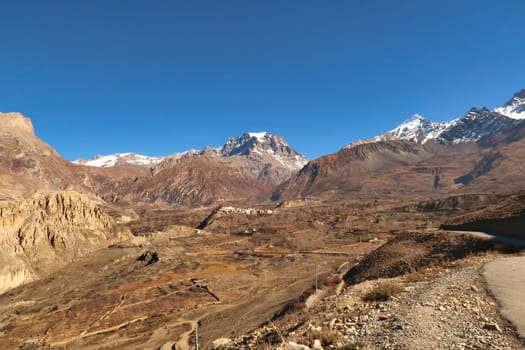 View from the road onto farmland, the rural landscape below the traditional village of Jharkot in front of Thorong, Thorung, La Pass, close to Muktinath, Annapurna Circuit Trek, Nepal 2022