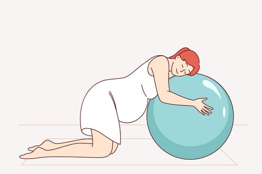 Pregnant woman doing pilates on fitness mats and leaning on inflatable ball. Preparing for childbirth for pregnant girl who cares about health and takes preventive measures to combat difficulties