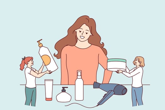 Woman chooses hair styling method while standing near table with shampoos and creams or hair dryer. Little cosmetologists advertise own products for skin care and creating fashionable hairstyles