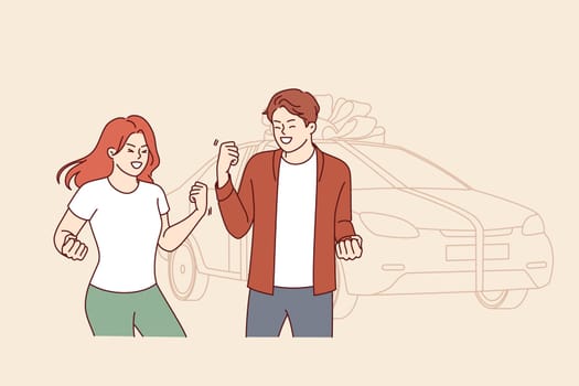 Gift car tied with large bonus stands near overjoyed couple who won automobile in lottery. Inspired man and woman celebrating receiving gift car for convenient trips to work or travel
