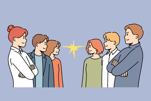 Groups of competing office workers look at each other demonstrating courage and readiness to fight. Competing business men and women seeking to demonstrate superiority over colleagues