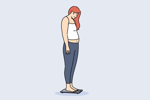 Problem of obesity and weight gain about depressed woman standing on electronic floor scale. Girl became obese due to poor diet or problems with metabolism that prevented absorption of foods.