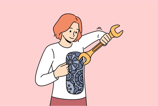 Woman independently restores mental health by repairing mechanism inside herself. Girl independently strives for progress, using wrench to improve gears that form positive personal qualities