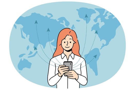 Woman with phone uses 5G technology standing near world map and exchanging information with international servers. Girl with smartphone is addicted to surfing net thanks to fast 5G connection
