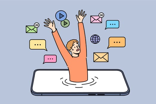Man with digital addiction has become slave to mobile phone, and is drowning in gadget display. Concept of problems caused by digital addiction and surfing too long in smartphone applications