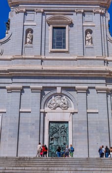 Madrid, Spain: April 24, 2024: People at the entrance of the Almudena Cathedral, Santa Maria la Real de La Almudena.