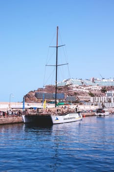 Gran Canaria, Spain, Canary Islands, Puerto Rico - Jul 17, 2024. Catamaran sailing ship in the harbour of Puerto Rico. Coastal trip for whales and dolphins.