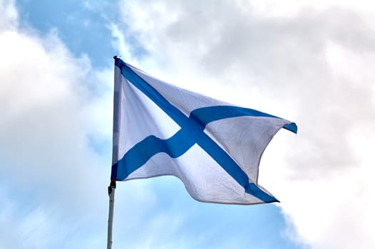 the flag of the Russian navy develops against the sky. High quality photo