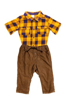 Trendy stylish brown pants or trousers for child boy with yellow brown checkered shirt With short sleeves isolated on a white background. Childrens summer fashion.