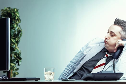 Businessman is covering his alcoholism with a facade of strength and cheerfulness while at work issues of alcoholism in the workplace