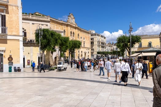 Italy, Matera - May 22, 2024: Lots of people walking in the  Vittorio Veneto Square (Piazza Vittorio Veneto). It is the main square in the city, a popular meeting place