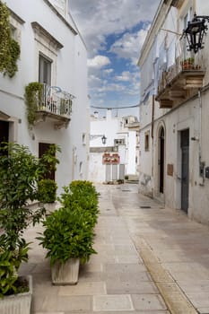 Martina Franca, Italy, Puglia - May 25, 2024: Narrow, stone street typical of Mediterranean countries