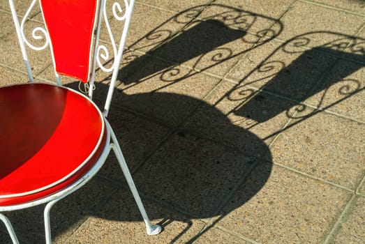 Red chair outdoor with shadow