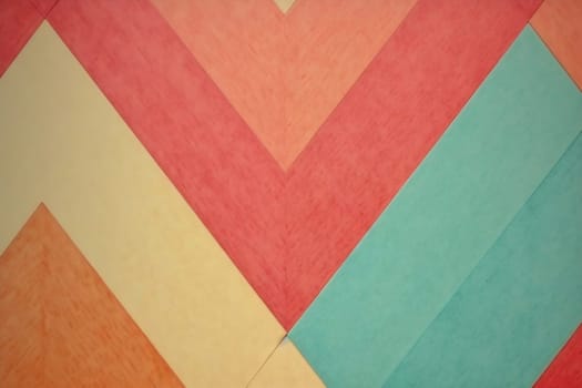 Bright chevron pattern displays a mix of red, orange, yellow, and blue shades, creating a lively visual effect.