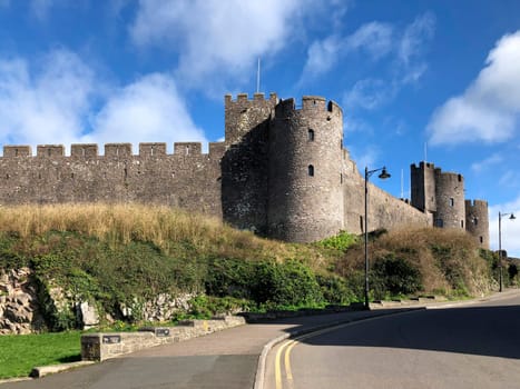 Pembroke Castle - medieval castle in Pembroke, Pembrokeshire, Wales. The castle was the original family seat of the Earldom of Pembroke. A Grade I listed building, it underwent major restoration during the early 20th century.