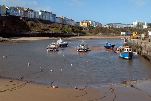 Tenby harbor in Carmarthen Bay at low tide - Tenby in Pembrokeshire, south Wales in the United Kingdom.
