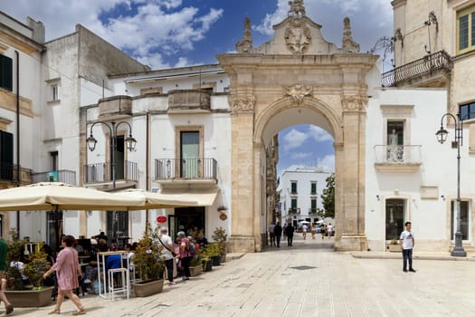 Martina Franca, Italy, Puglia - May 25, 2024: Medieval St. Stephen's Gate (Porta di Santo Stefano), baroque gate to old Town. It is located between Piazza XX Settembre and Piazza Roma